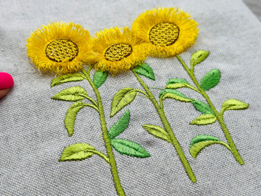 Three Fringed Sunflower Stems in a row