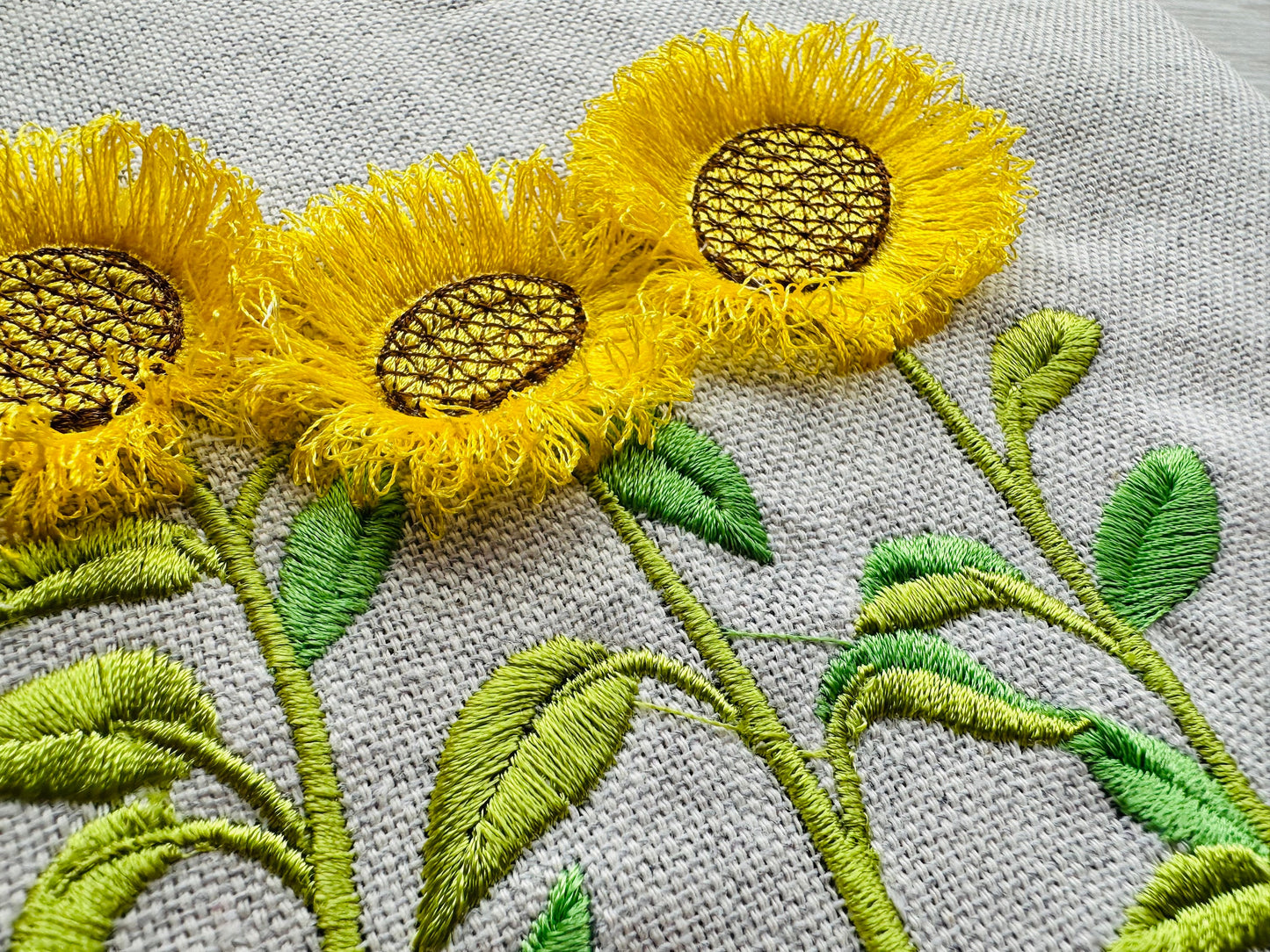 Three Fringed Sunflower Stems in a row