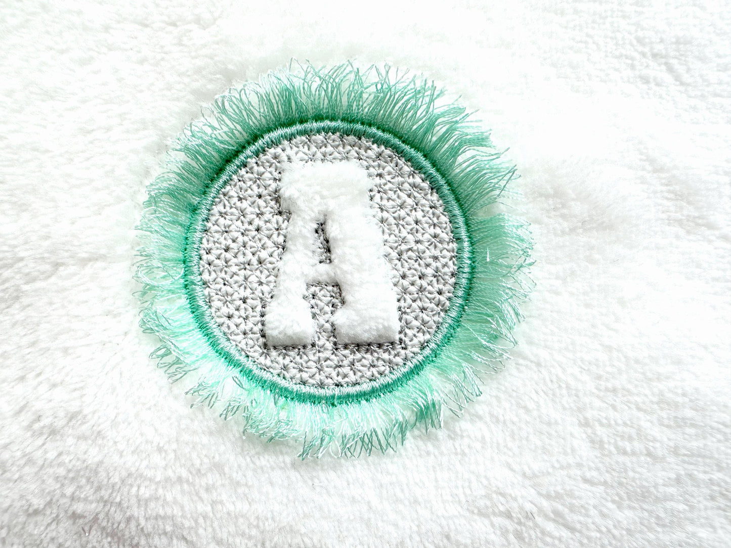 Embossed Monogram Fringed Frame