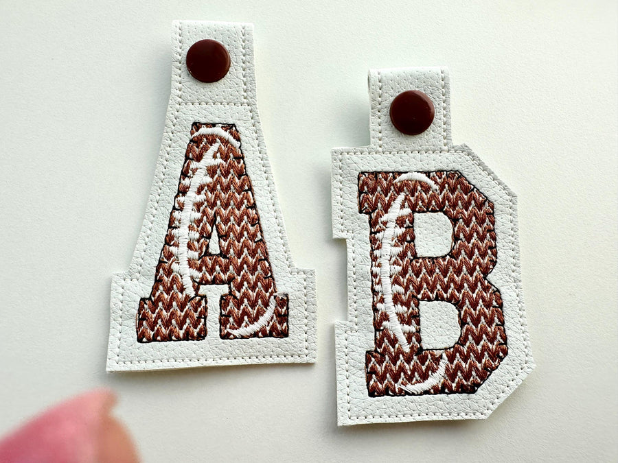Knit stitch effect Football Eyelet and Key Fob Snap Tab Block sport