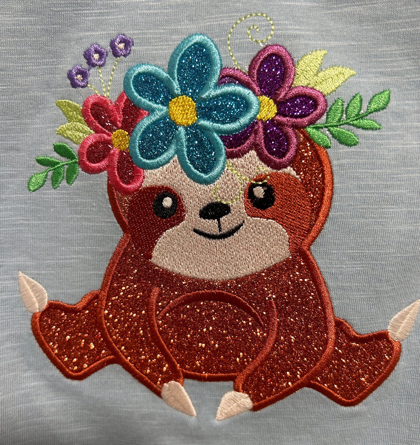 Sloth with floral crown wreath of flowers applique machine embroidery