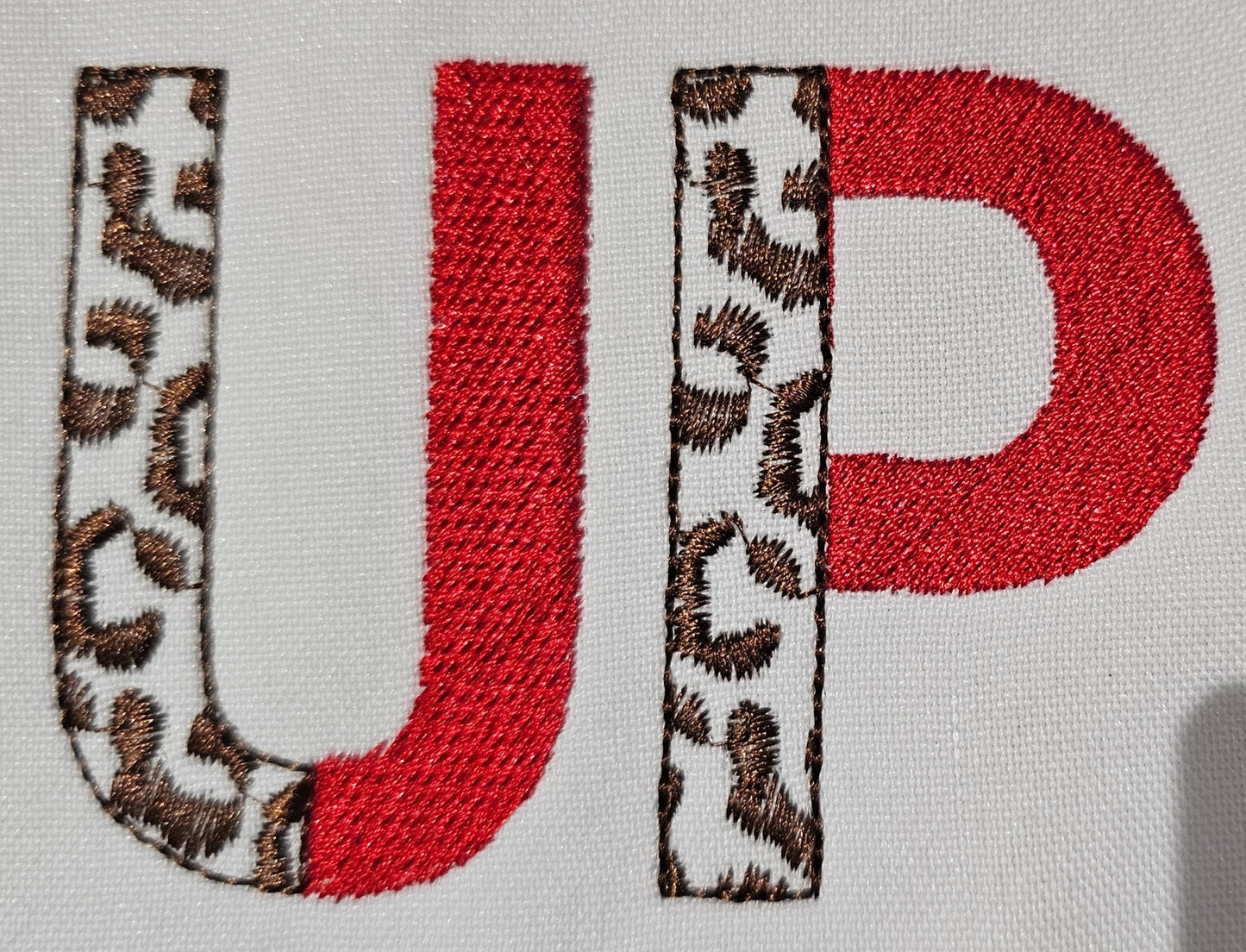 Leopard Spots and Fill Stitch Duotone Split Font