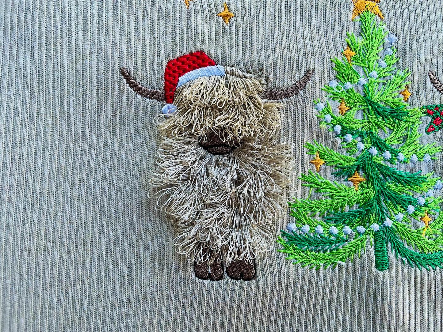 Fringed Highland Cow with Christmas Tree