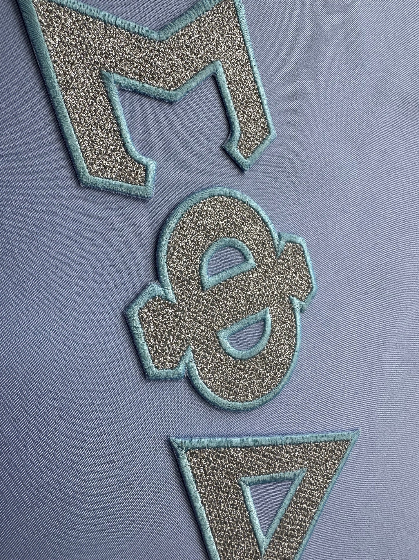 Glitter Greek Font light stitch diamonds and satin stitch outline