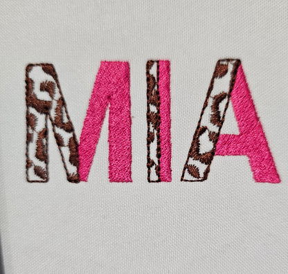 Leopard Spots and Fill Stitch Duotone Split Font