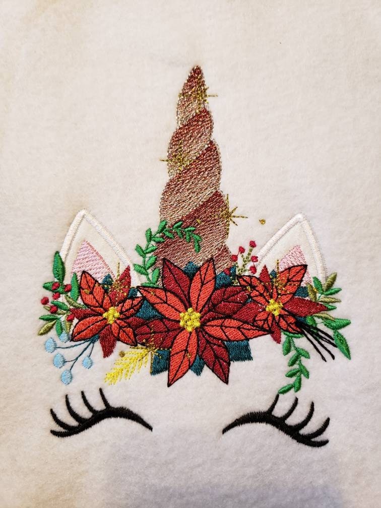 Christmas Poinsettia Unicorn – Animal machine embroidery design by Artapli