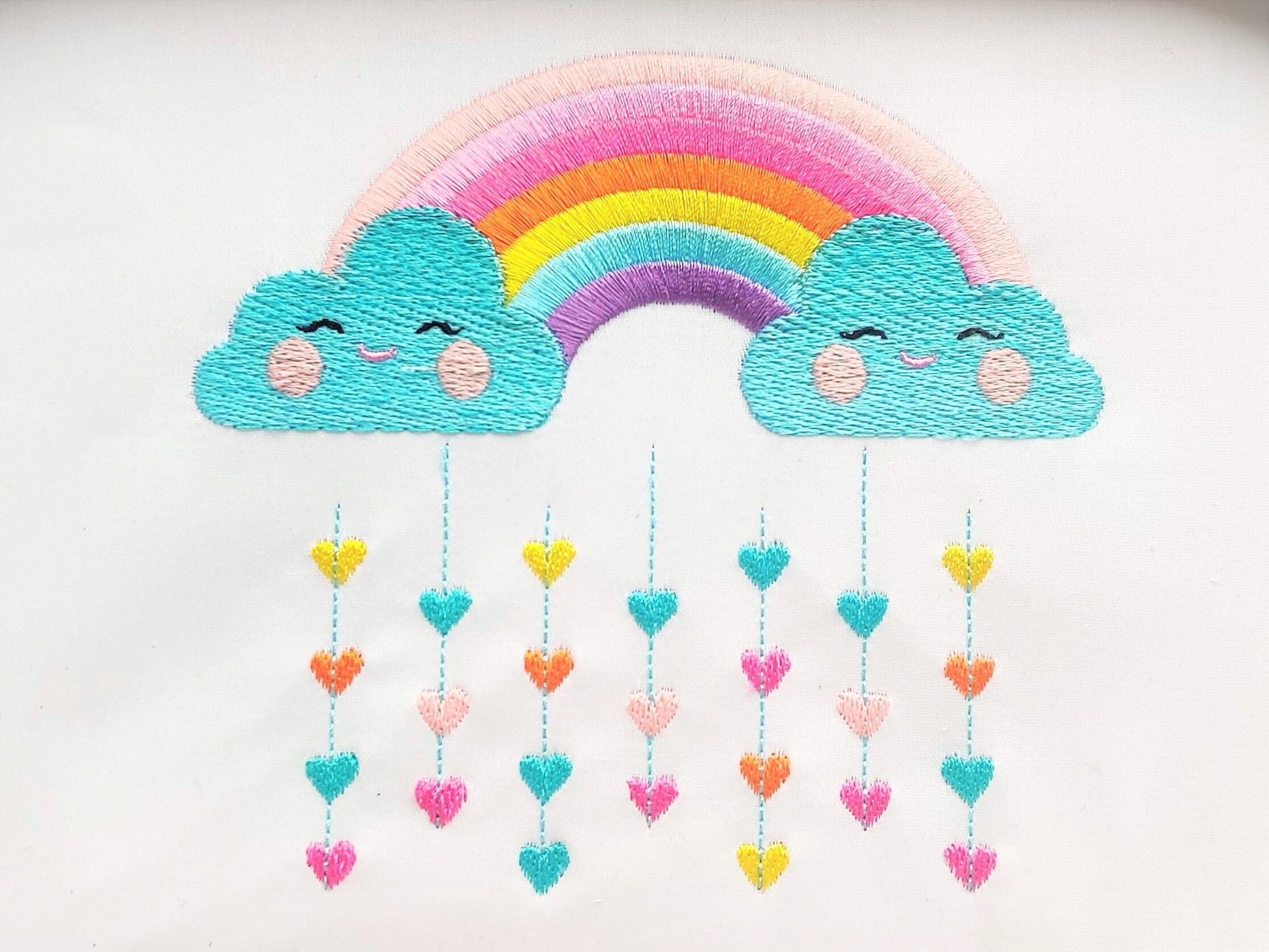 Cute Rainbow with pretty clouds and rainy falling hearts machine embroidery designs