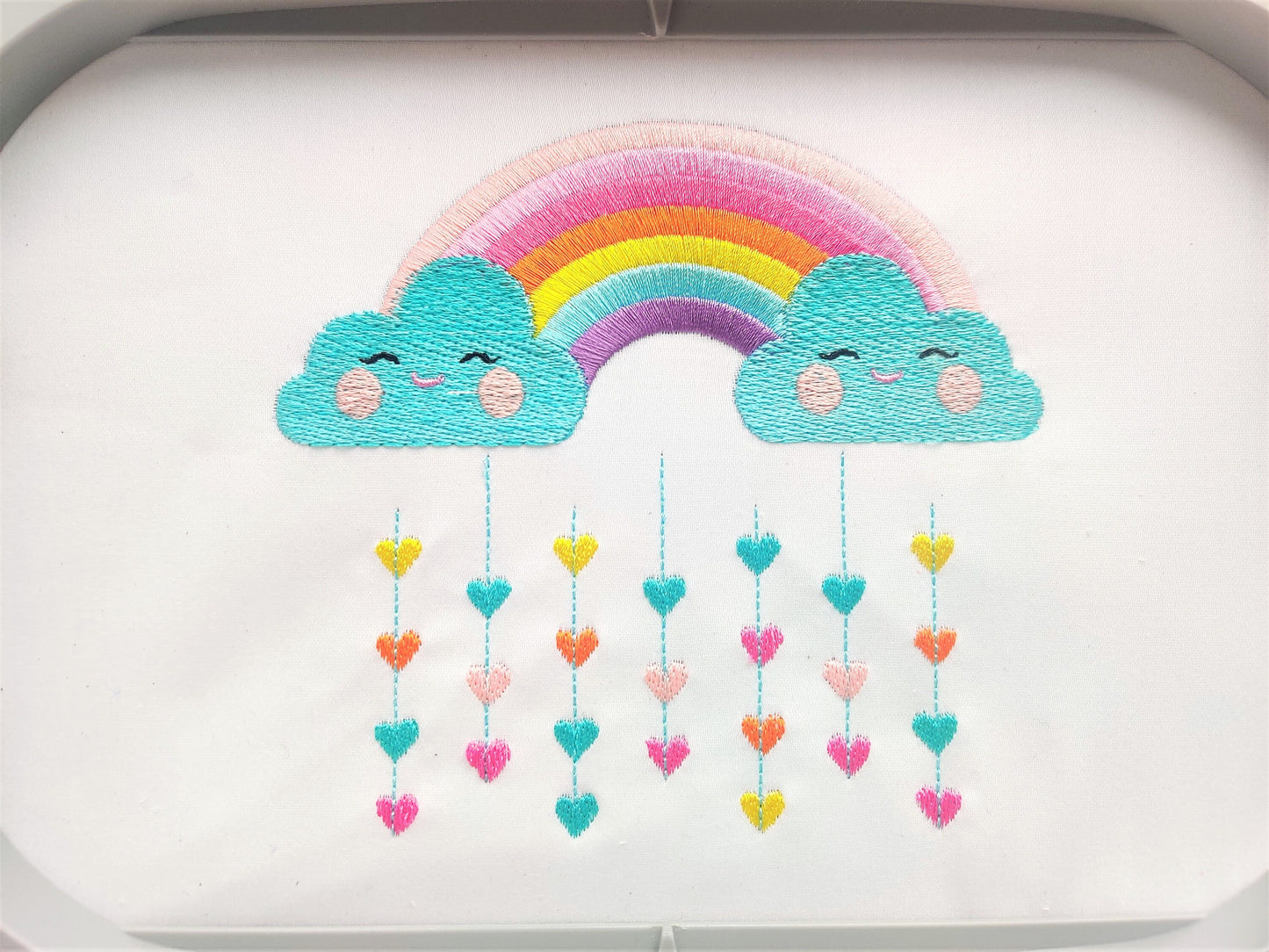 Cute Rainbow with pretty clouds and rainy falling hearts machine embroidery designs