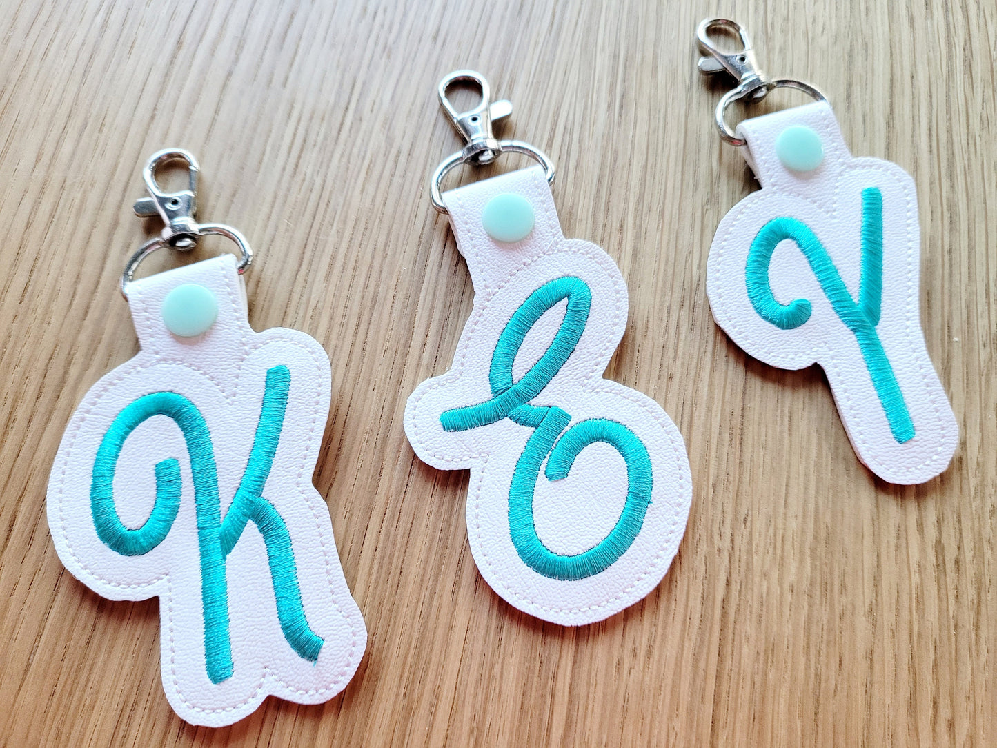 Key fob snap tab Monogram script initial letters from A up to Z in the hoop ITH keyfob bag tag keychain machine embroidery designs