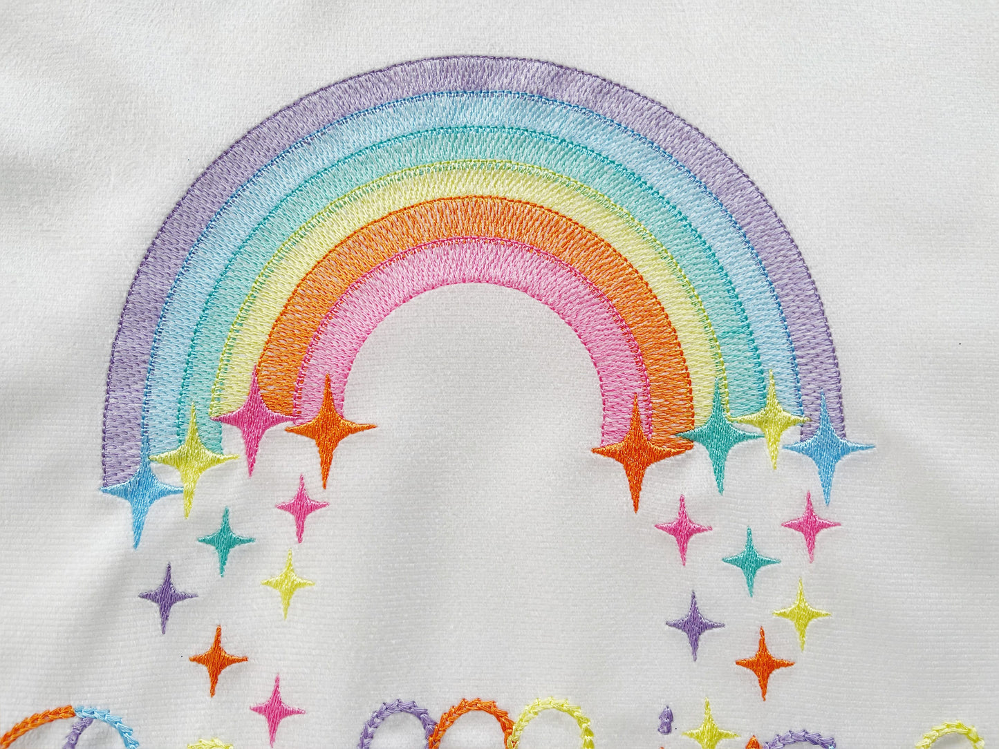 Light stitch rainbow with falling stars starrymachine embroidery designs