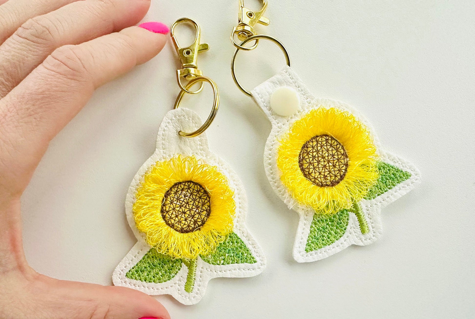 Sunflower key fob snap tab and eyelet sunflower keychain in the hoop machine embroidery designs ITH project flower fluffy fuzzy sunflower