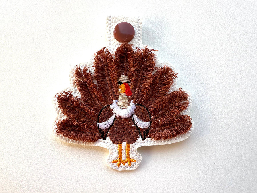 Fringed Turkey eyelet and key fob snap tab in the hoop machine embroidery designs ITH keychain Awesome fluffy fur Thanksgiving backpack tag