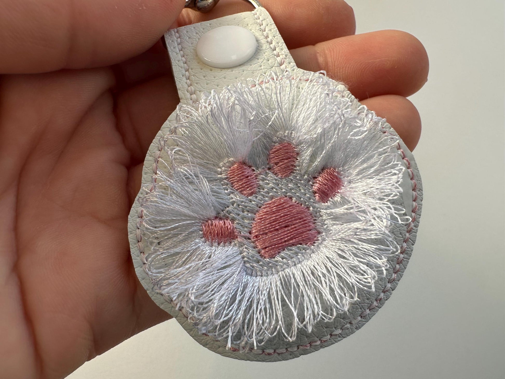 Fringed Cat Kitty Paw Eyelet and Key Fob Snap Tab in the hoop machine embroidery designs ITH project key ring keychain fluffy fur cute Paw