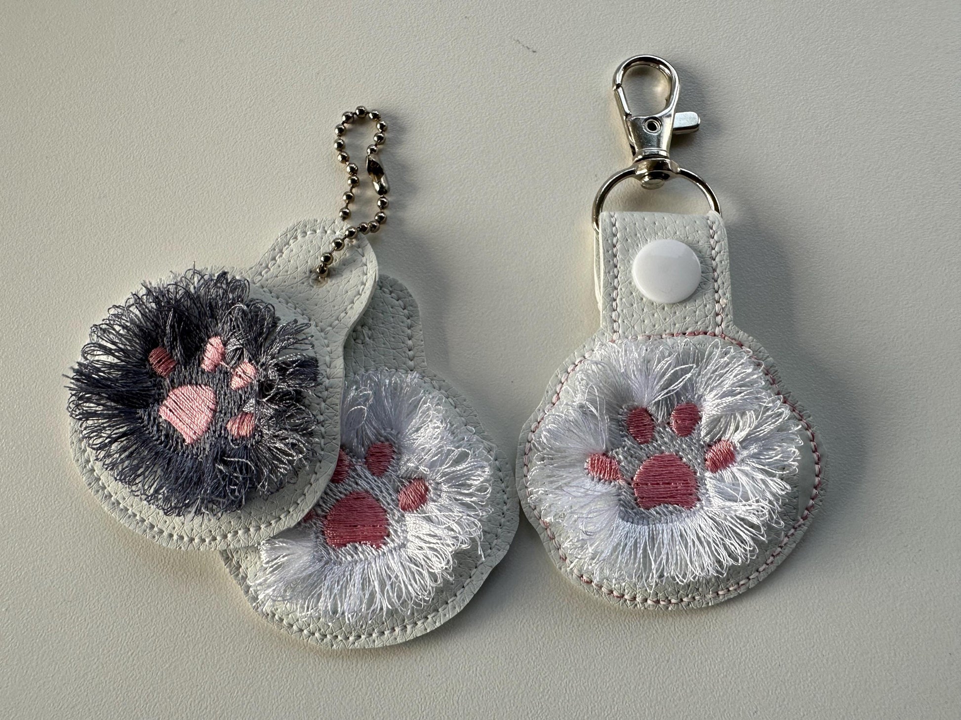 Fringed Cat Kitty Paw Eyelet and Key Fob Snap Tab in the hoop machine embroidery designs ITH project key ring keychain fluffy fur cute Paw