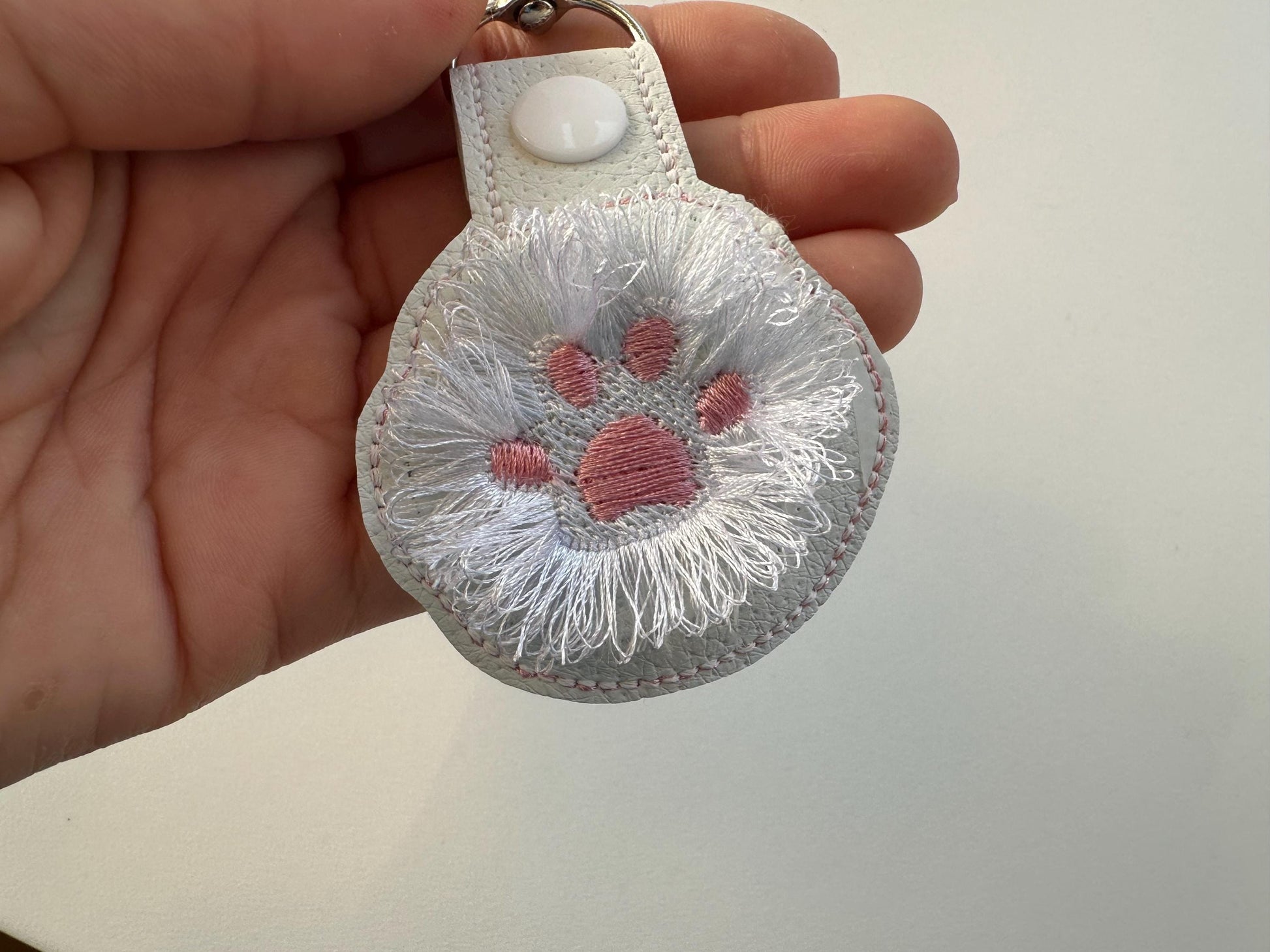 Fringed Cat Kitty Paw Eyelet and Key Fob Snap Tab in the hoop machine embroidery designs ITH project key ring keychain fluffy fur cute Paw