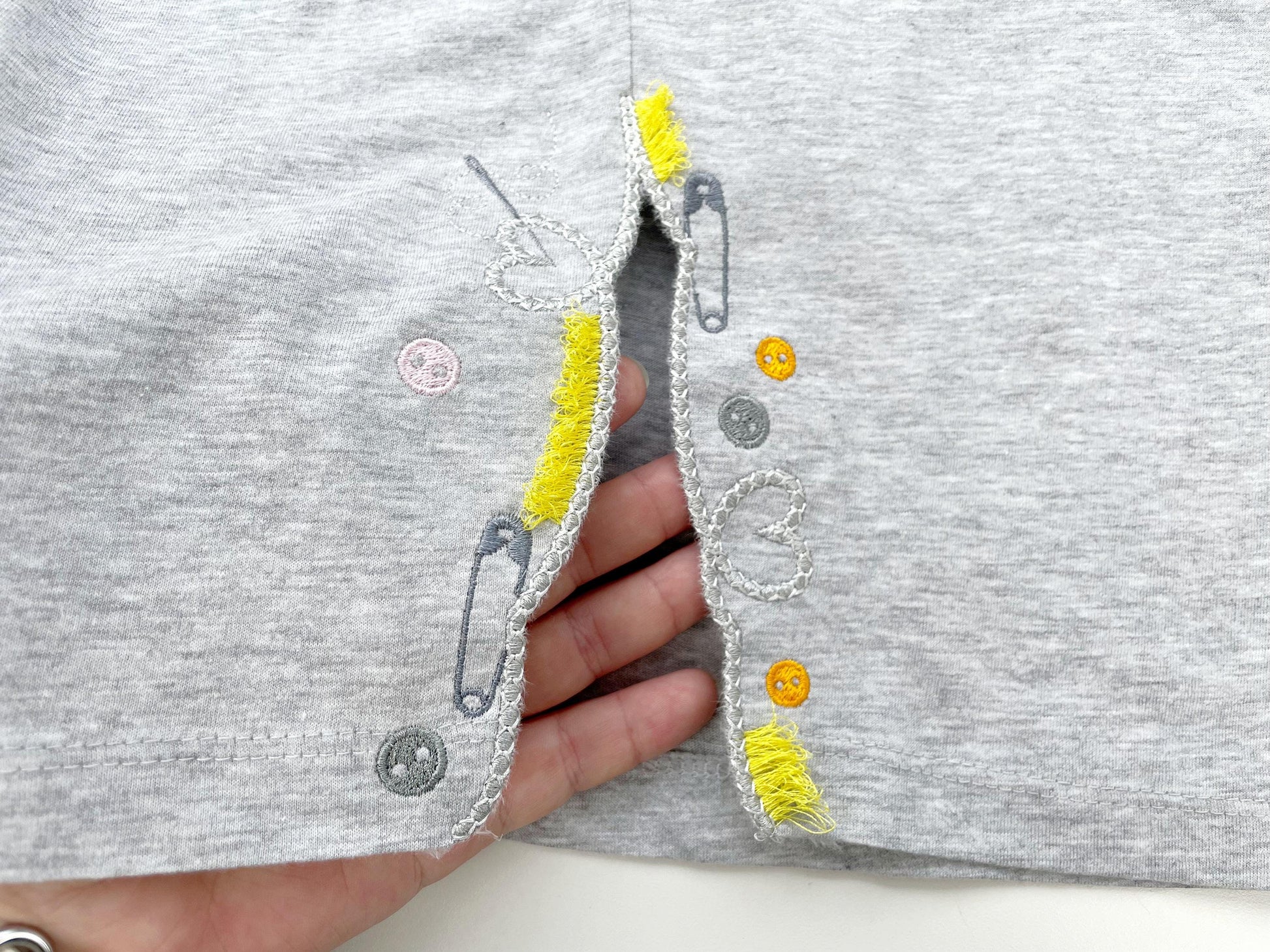 Seamstress split side seam cutout side bow machine embroidery designs sweatshirt t-shirt outfit Heart Button Safety Pin