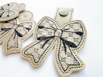 Chic Mini Bow Eyelet and Key Fob snap tab keychain ITH in the hoop machine embroidery designs