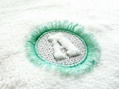 Embossed Monogram Fringed Frame