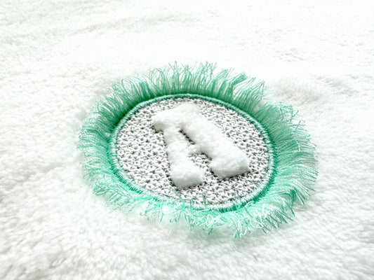 Embossed Monogram Fringed Frame