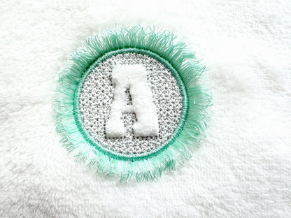 Embossed Monogram Fringed Frame