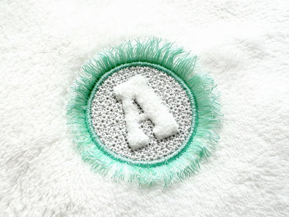 Embossed Monogram Fringed Frame
