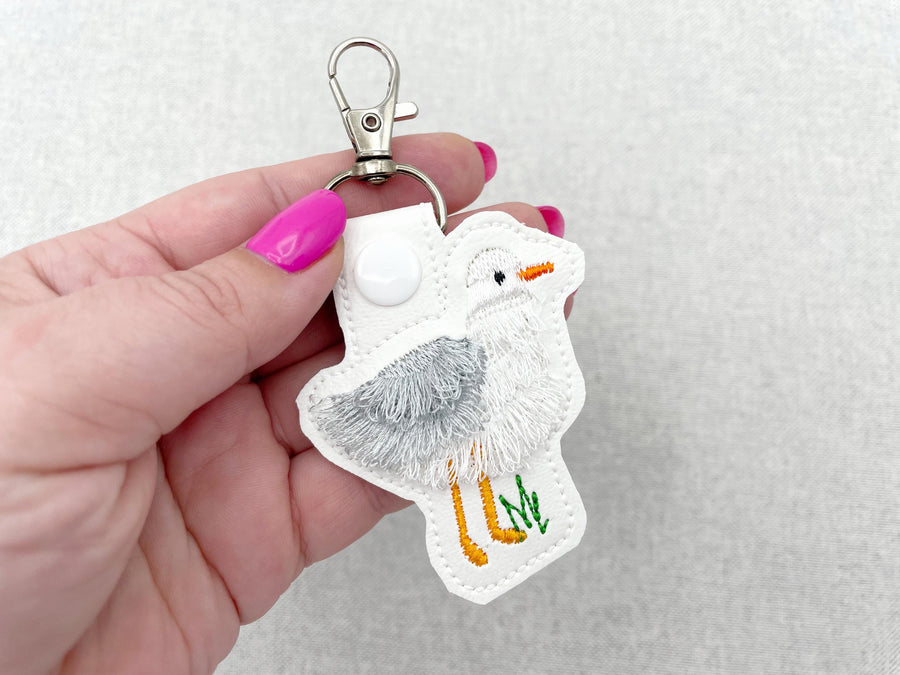 Fringed Seagull Eyelet and Key Fob snap tab in the hoop machine embroidery designs wild sea bird beach fringe keychain gift idea ITH project